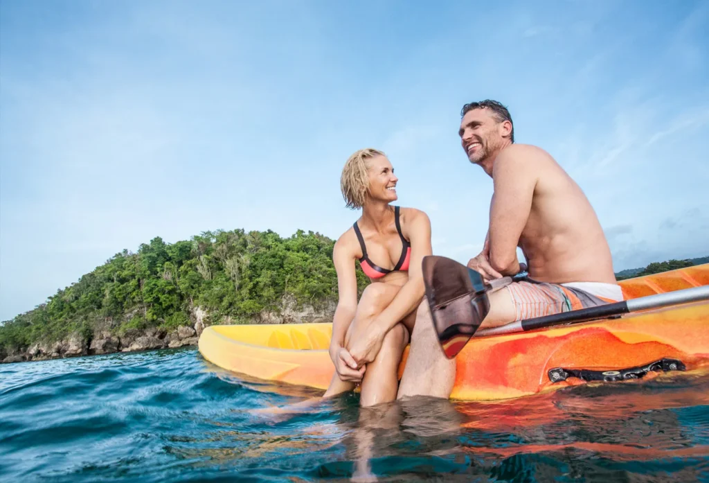 couple kayaking in ocean