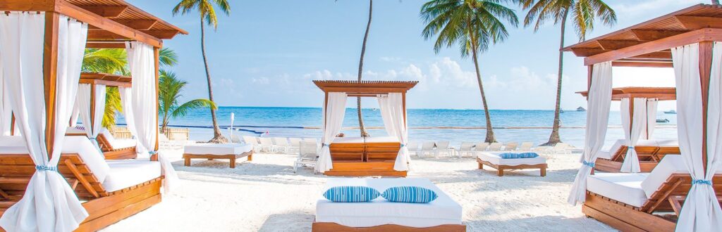 loungers on white sand beach