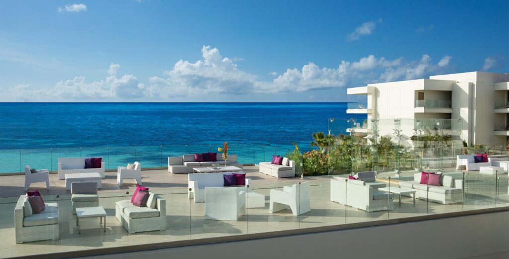 outdoor couches overlooking the blue ocean