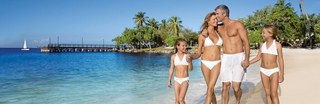 family walking on beautiful beach in Dominican Republic