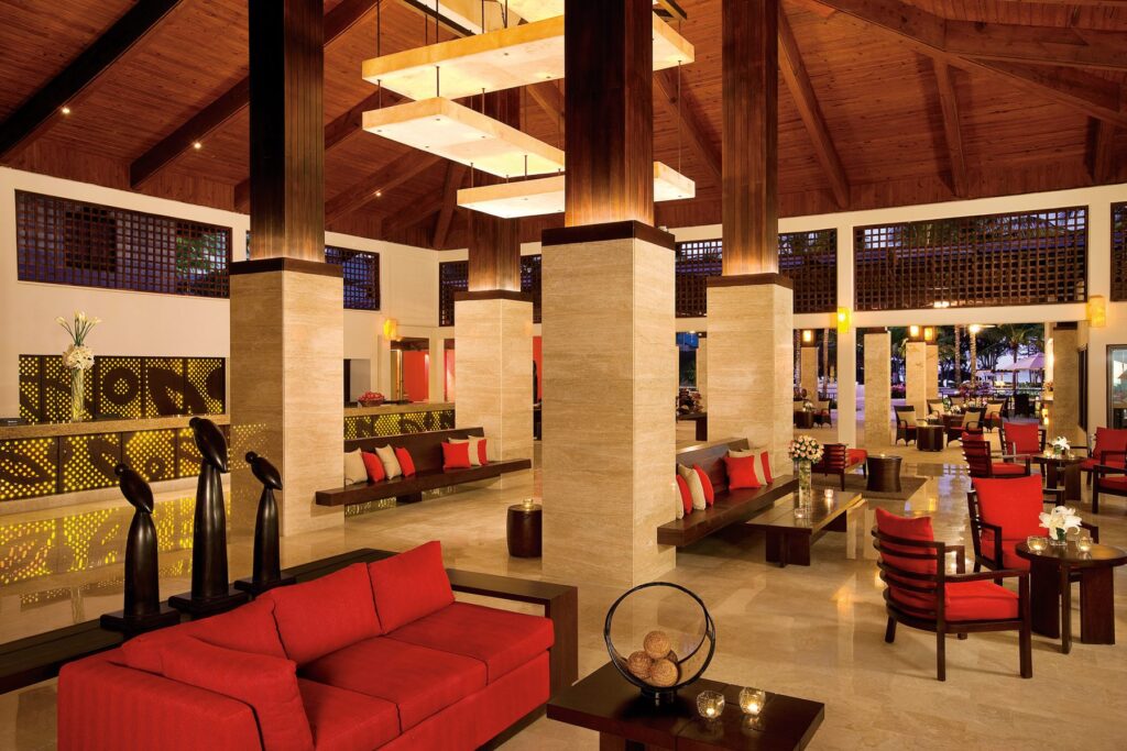 lobby area with blush chairs and couches at Dreams La Romana resort