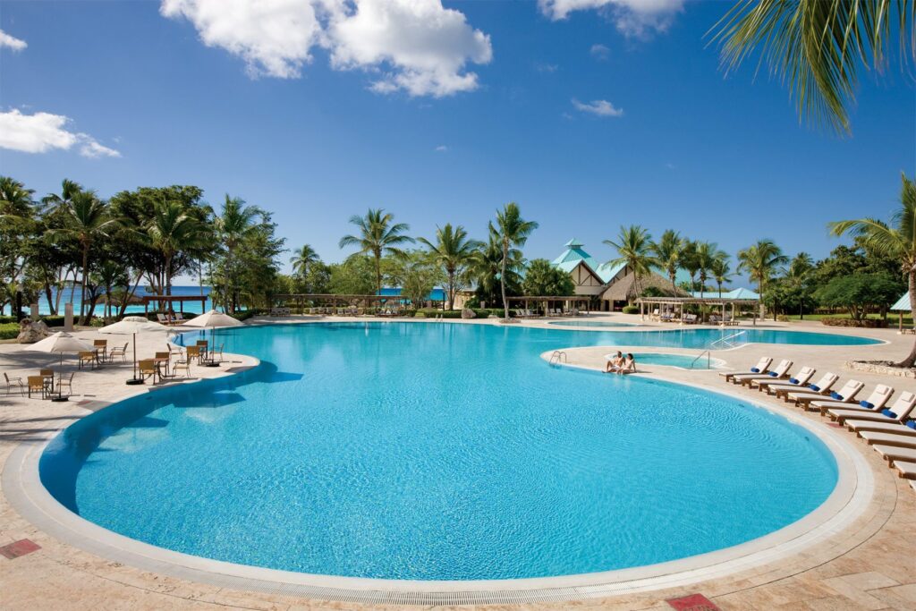 large pool surrounded by sun loungers