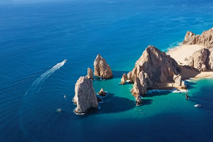 large rock formation on tropical beach