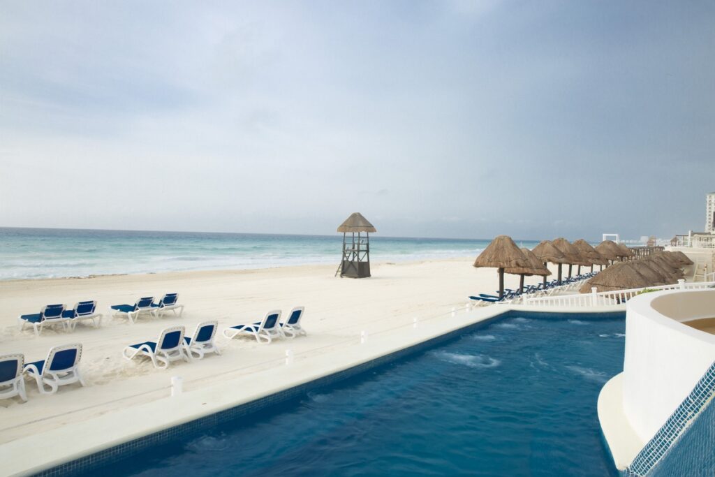 white sand beach at Golden Parnassus Resort and Spa