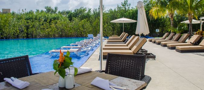 loungers around  pool at Moon Palace Cancun