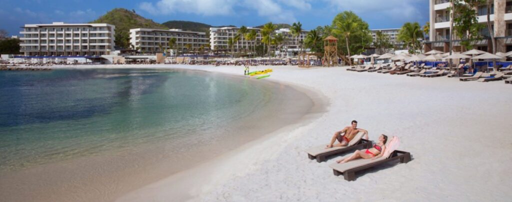 couple lounging on beach in st. lucia