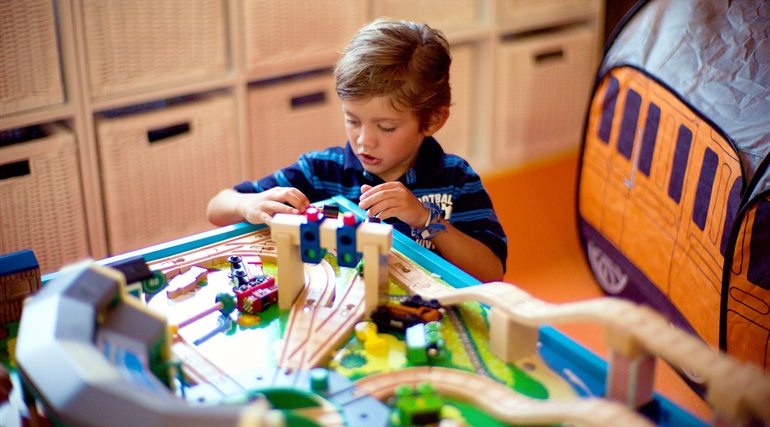 child playing in resort play area