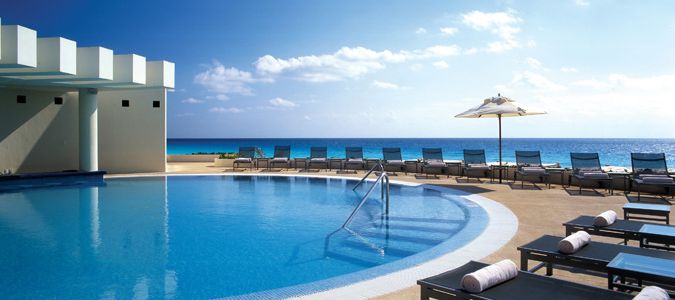 pool overlooking Cancun beach