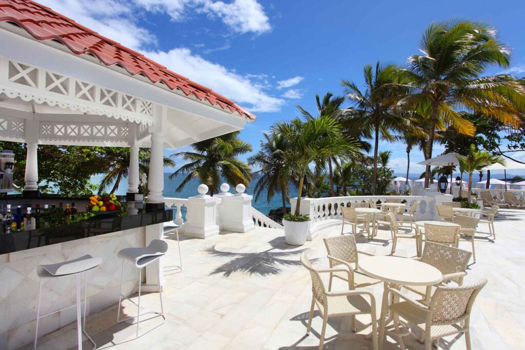 bar and outdoor dining area overlooking the ocean at Luxury Bahia Principe Samana