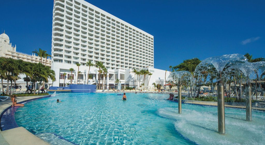 pool in front of large Riu Palace Antillas resort