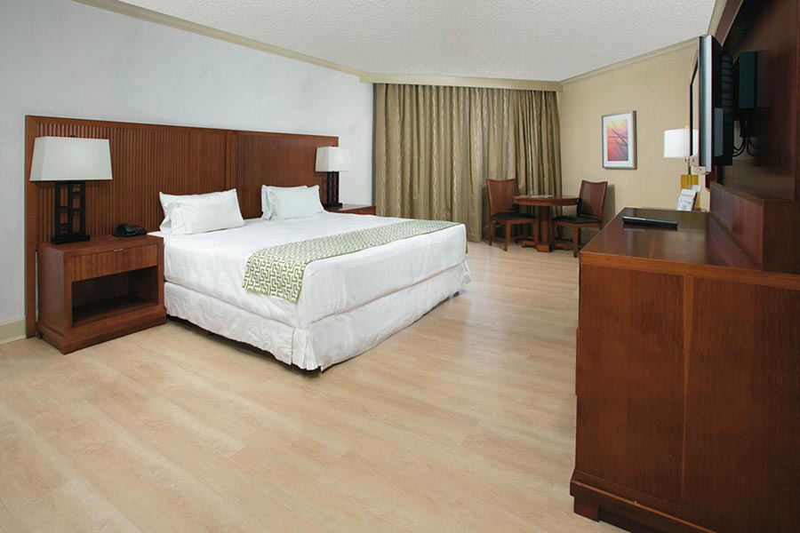 spacious suite with king bed at Riu Palace Antillas