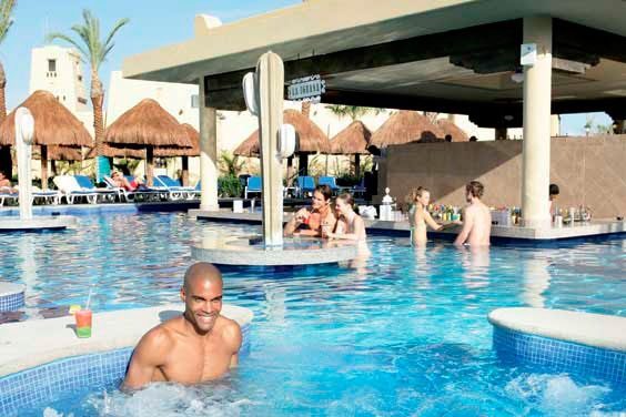 guests swimming at swim up bar at Riu Santa fe