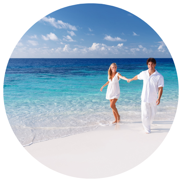 couple holding hands on tropical beach