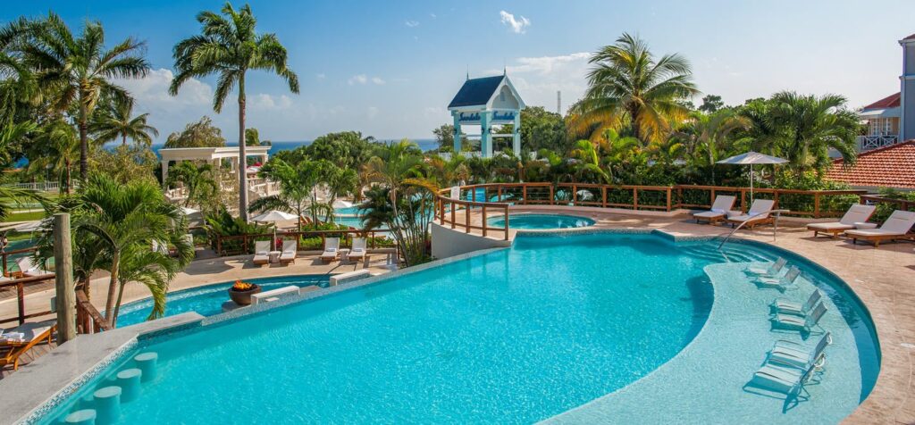 pool with lounge chairs and swim up bar