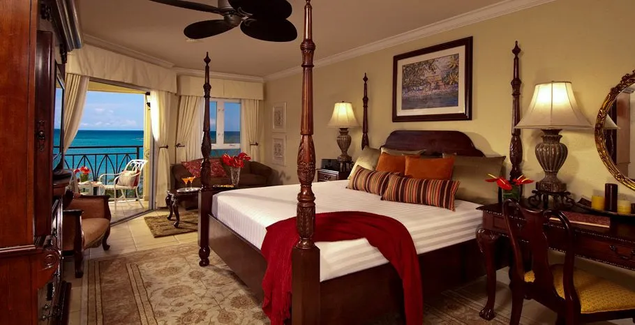 Sandals South Coast room with four poster bed and oceanfront balcony