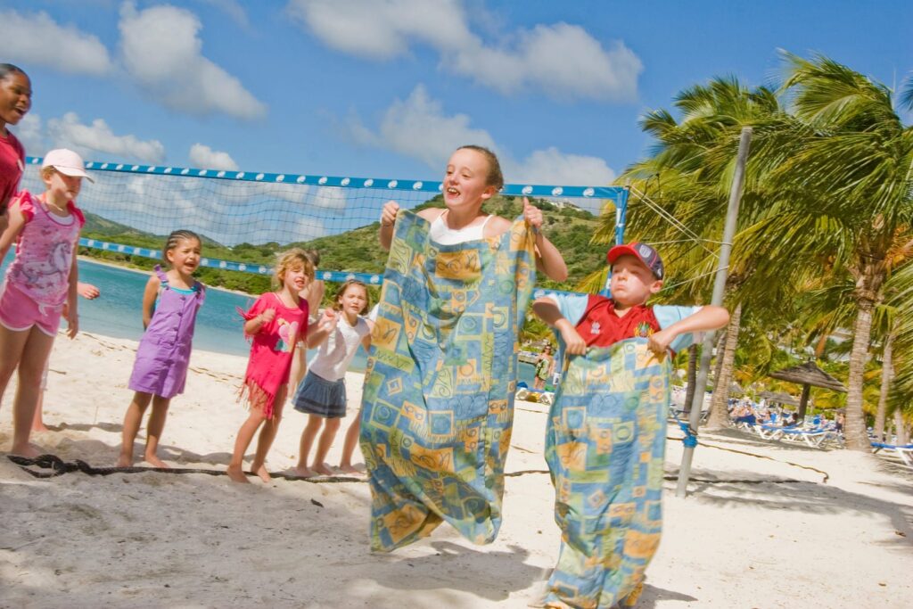 children playing games on the beach