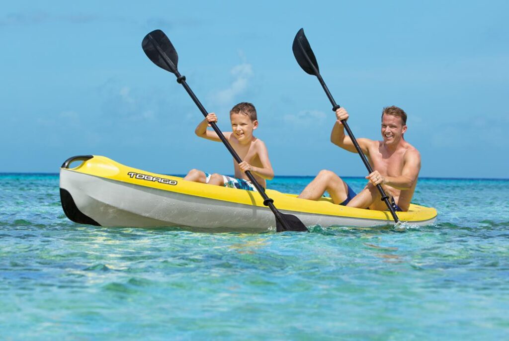 father and son paddleboarding