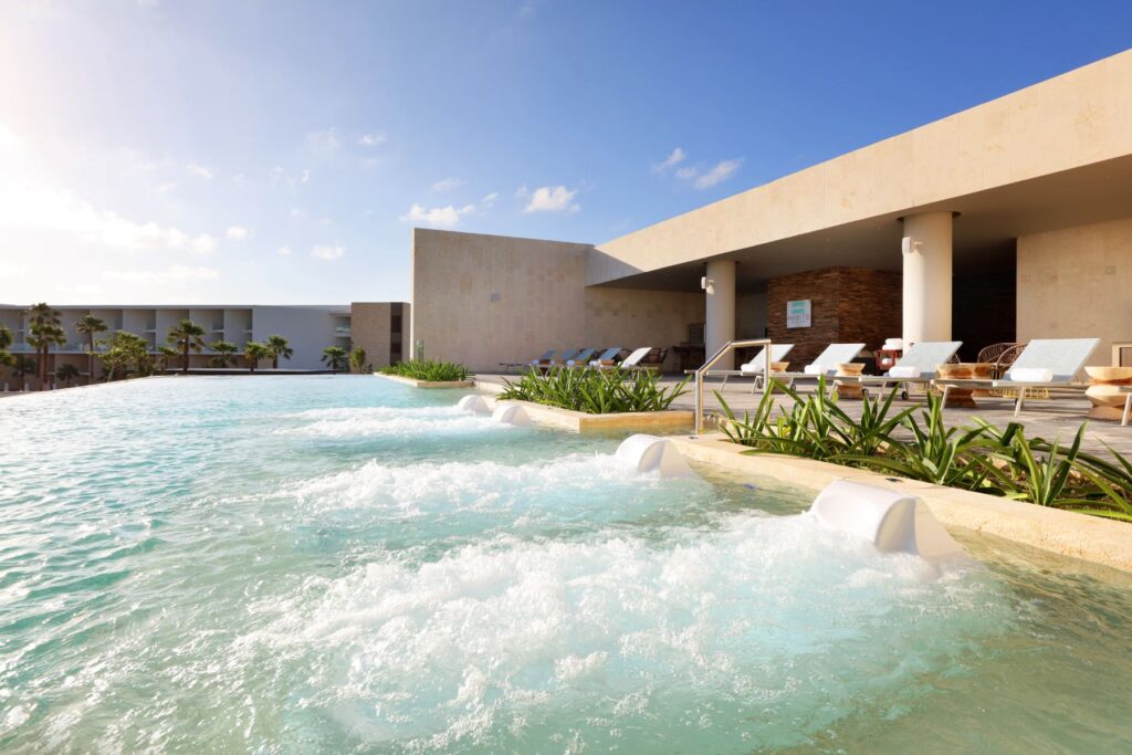 pool with sun loungers at TRS Coral Hotel