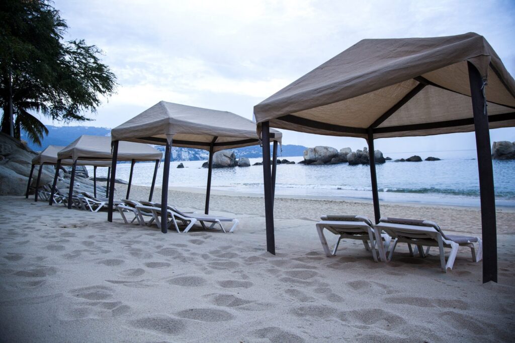 covered loungers on the beach