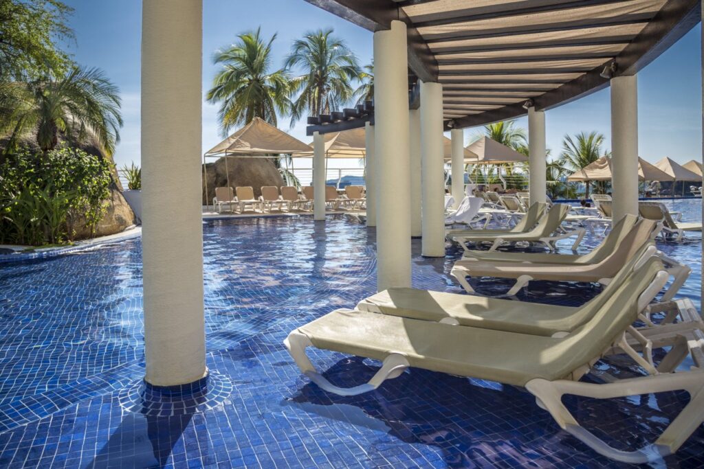 loungers in pool