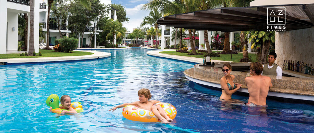 kids playing in pool and adults at swim up bar at Azul Beach Resort The fives