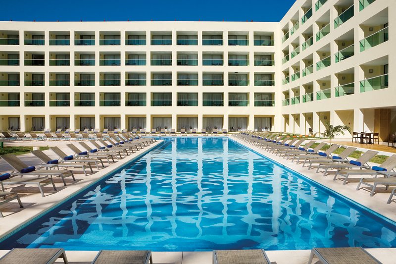 pool surrounded by sunchairs at Mexico resort