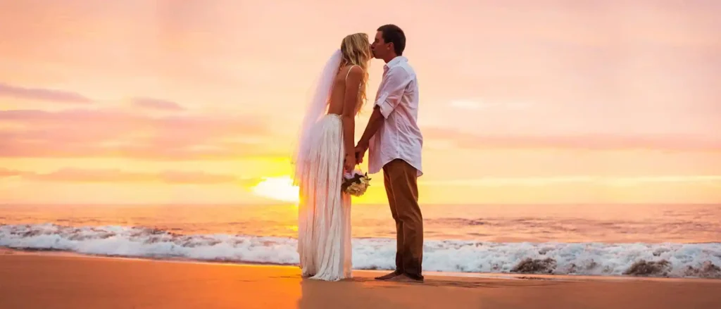 Beach wedding at sunset