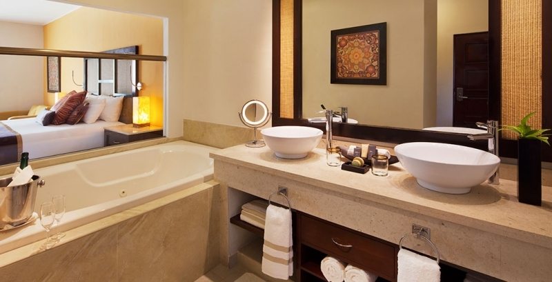 suite with large bathtub and spa-like bathroom