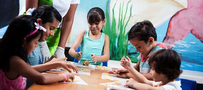 Kids doing arts and crafts at children's program