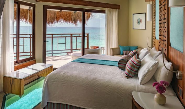 interior of overwater bungalow at el dorado maroma palafitos