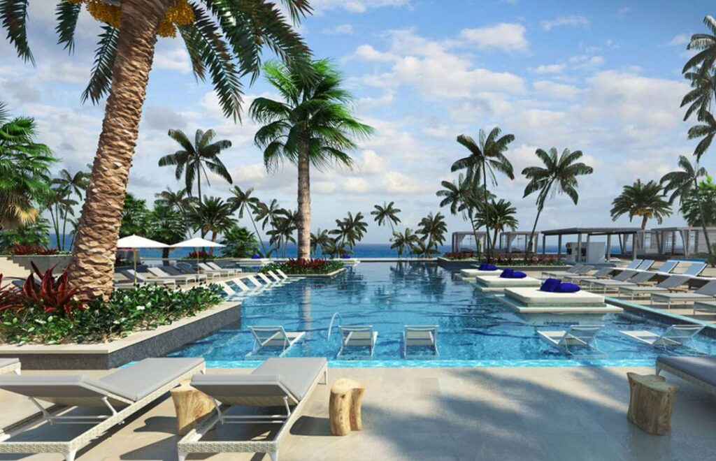 pool surrounded by palm trees at Unico 20 87