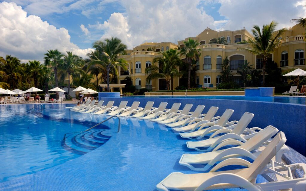 sun loungers in pool