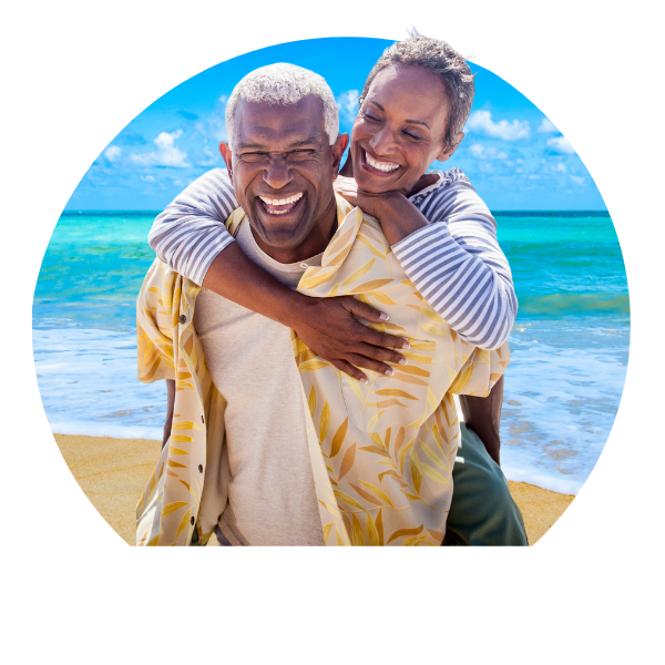 couple smiling and laughing on romantic, tropical beach