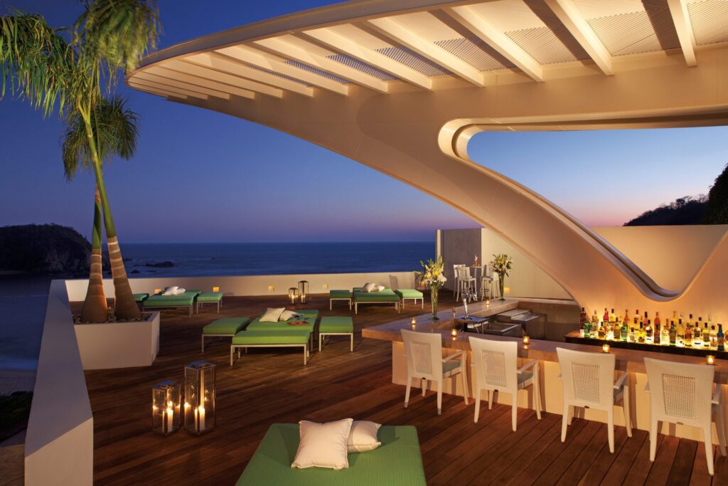 rooftop bar with view of ocean at Secrets Huatulco Resort & Spa