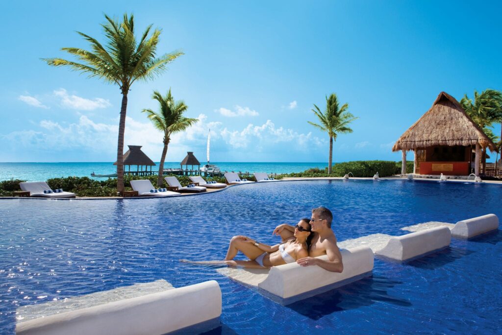 couple lounging in pool