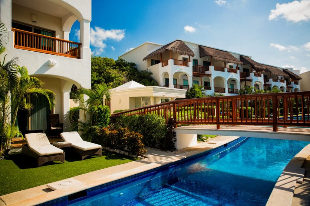 bridge over resort pool at Valentin Imperial Maya